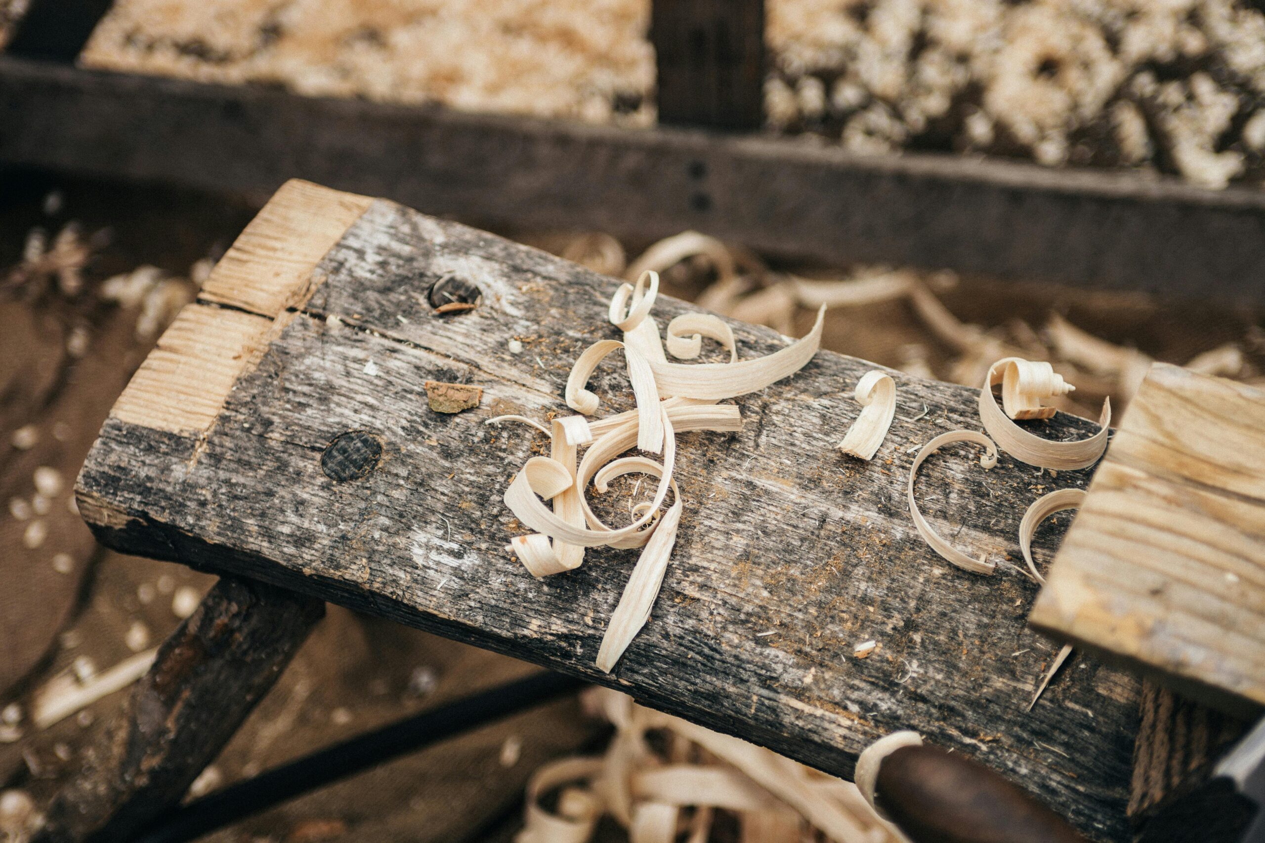 Ostento Marketplace - Handmade Craft Independent woodworker at a workbench